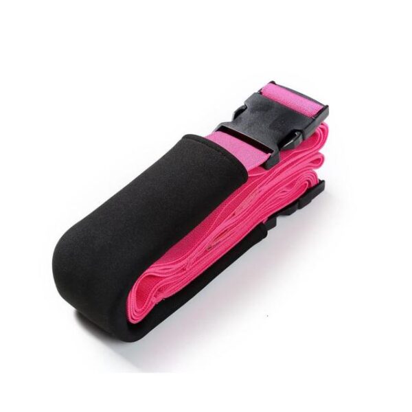 A pink and black strap is sitting on top of the strap.