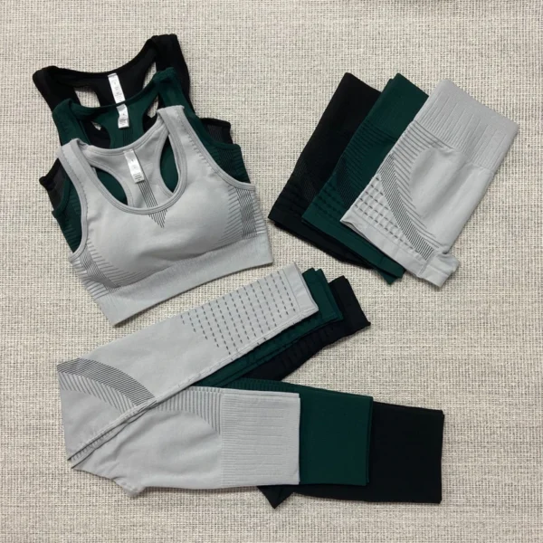 A pair of green and white sports bras, leggings and socks.