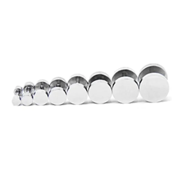 A group of metal plugs lined up in a row.