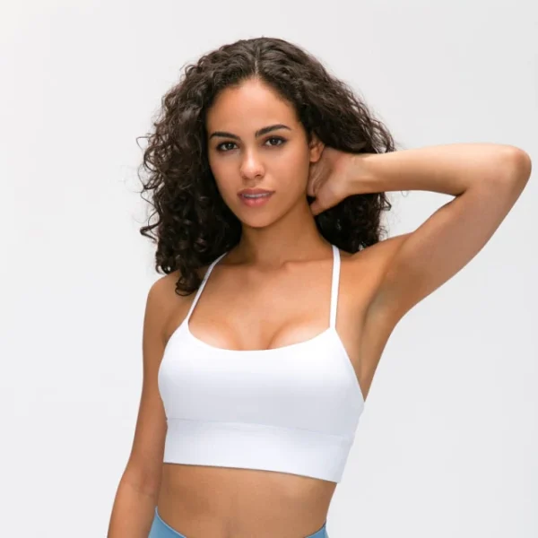 A woman in white bra and blue shorts.