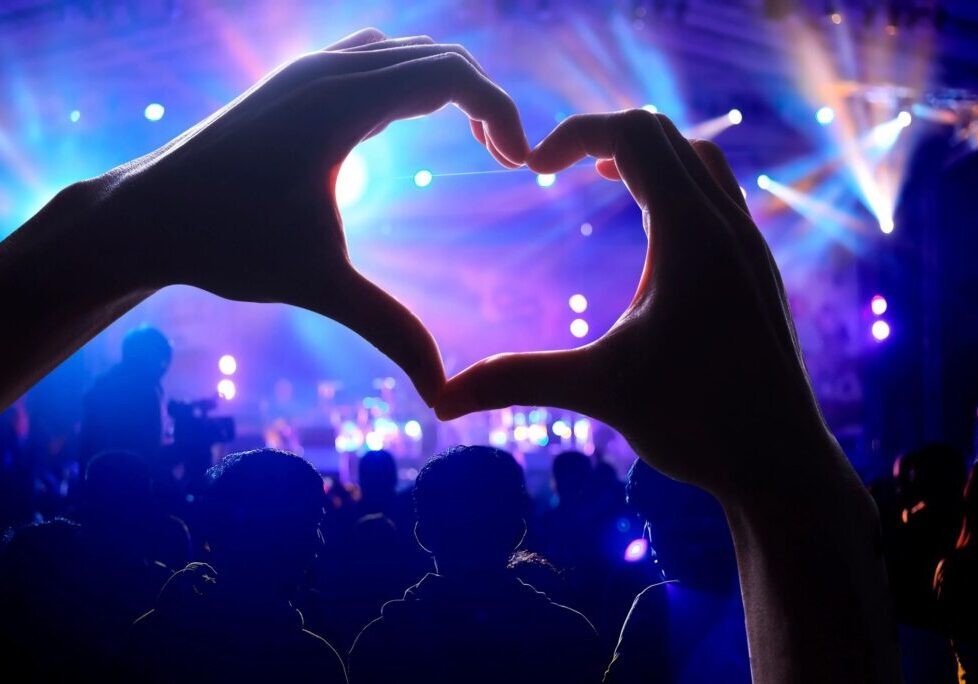 A person making a heart with their hands